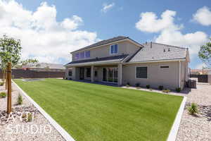 Back of property with central air condition unit, stucco siding, and a patio
