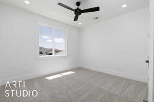 Spare room featuring a ceiling fan, carpet, baseboards, and recessed lighting