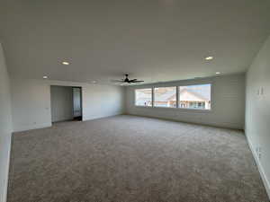 Unfurnished room with recessed lighting, carpet, ceiling fan, and baseboards