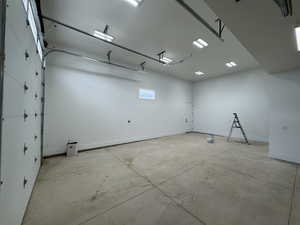Garage featuring baseboards