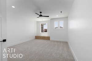 Spare room featuring ceiling fan, baseboards, light carpet, and recessed lighting