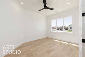 Spare room featuring ornamental molding, ceiling fan, recessed lighting, light wood-style flooring, and wooden ceiling