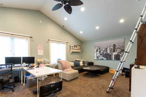 Carpeted office space with recessed lighting, ceiling fan, a healthy amount of sunlight, and high vaulted ceiling