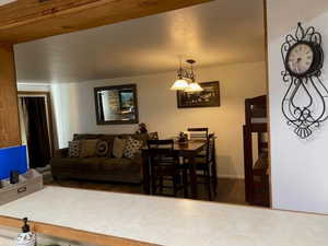 Living area featuring baseboards and wood finished floors