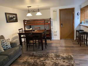 Dining area featuring baseboards and wood finished floors