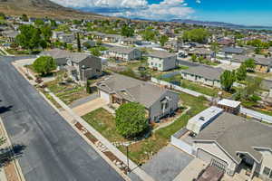 Birds eye view of property with a mountain view and a residential view