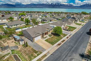 Birds eye view of property with a residential view and a water and mountain view