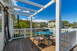Deck featuring a residential view and outdoor dining space