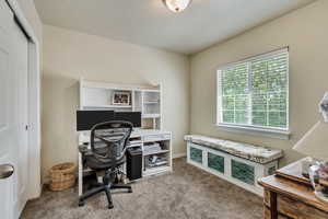 View of carpeted home office