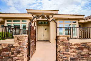 Entrance to property with stucco siding