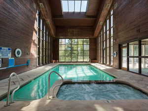 View of swimming pool with a pool with connected hot tub