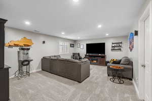 Living room featuring carpet floors, recessed lighting, baseboards, and visible vents