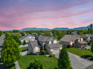 Birds eye view of property with a residential view and a mountain view