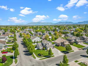 Drone / aerial view with a residential view and a mountain view
