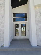 Doorway to property featuring french doors