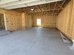 Garage featuring a garage door opener