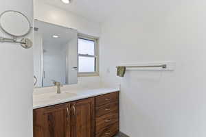 Bathroom with vanity and walk in shower