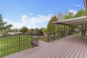 Deck featuring a yard