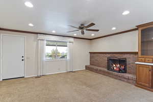 Unfurnished living room featuring ceiling fan, recessed lighting, and light colored carpet