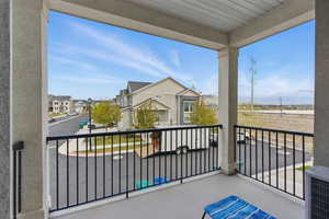 Balcony with central air condition unit and a residential view
