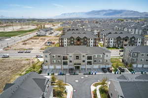 Birds eye view of property featuring a mountain view and a residential view