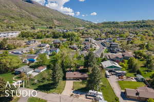 Birds eye view of property with a residential view and a mountain view
