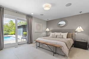 Primary bedroom with high end light fixtures, wall paper, Brand new Pietra Italia 24X24 white tile flooring,  sliding doors to backyard/pool/hot tub and primary bathroom
