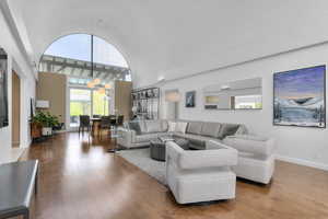 Living area featuringHardwood Maple Floors and towering ceiling