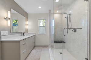Primary bathroom with Brand new Pietra Italia 24X24 white tile, high end fixtures, quartz counter tops