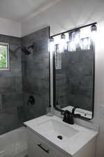 Full bath with shower / bathing tub combination and vanity