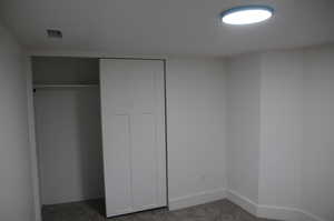 Unfurnished bedroom number four with a closet, carpet flooring, and baseboards