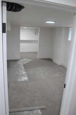 Unfurnished bedroom number three featuring walk in closet and carpet floors.