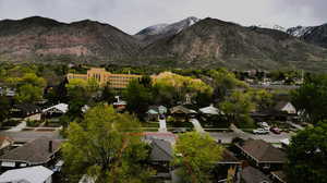 Property view of mountains featuring a residential view.