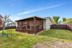 Rear view of house has lots of privacy and shade