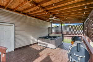 Covered hot tub with ceiling fan has lots of privacy