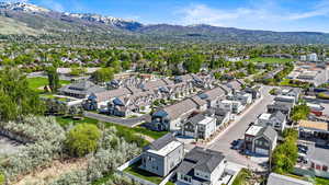 Birds eye view of property featuring a mountain view and a residential view