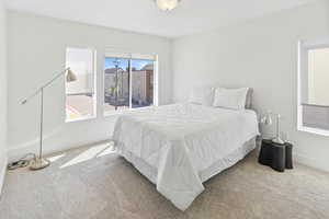 Bedroom featuring carpet floors and baseboards
