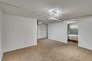 Finished below grade area with carpet floors and baseboards