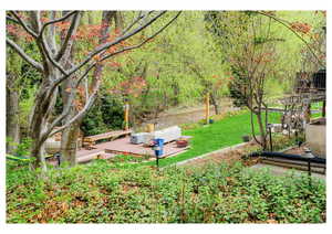 View of yard featuring a wooden deck