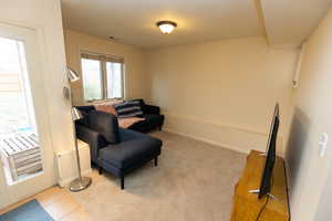 Sitting room featuring baseboards and visible vents