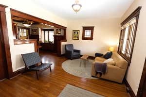Living room with baseboards and wood finished floors