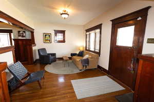 Interior space featuring baseboards and wood finished floors
