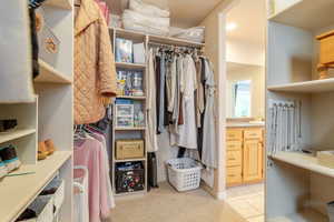 Walk in closet featuring light tile patterned flooring