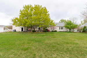 View of yard featuring fence