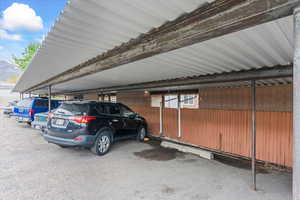 Covered parking lot with fence