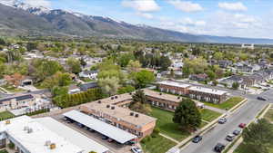 Birds eye view of property with a residential view and a mountain view