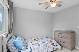 Bedroom with baseboards and a ceiling fan
