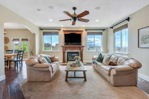 Family room with central audio speakers and beautiful views of nearby park and lake.