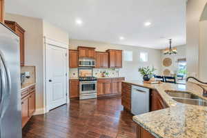 Custom wood cabinetry, stainless appliances and granite countertops