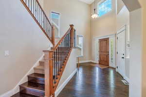 Two-story entryway with engineered hardwood floors
